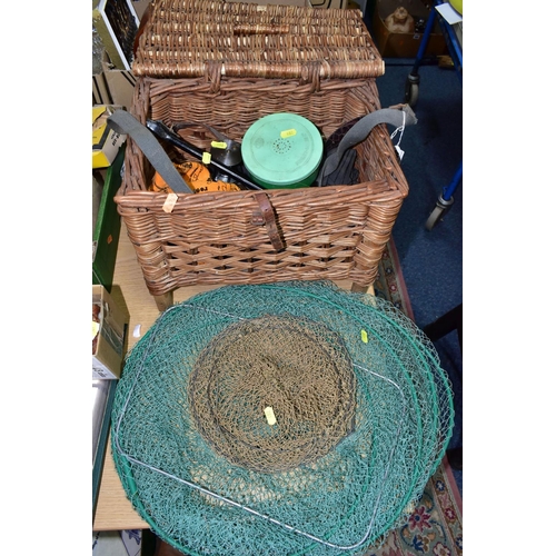 402 - A WICKER FISHING BASKET, KEEP NETS AND REELS, comprising a vintage wicker fishing basket with carry ... 