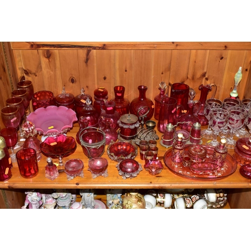 430 - A COLLECTION OF CRANBERRY GLASS AND OTHER GLASSWARES, to include cranberry glass vases, jugs, drinki... 