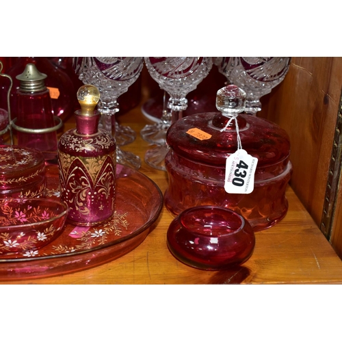 430 - A COLLECTION OF CRANBERRY GLASS AND OTHER GLASSWARES, to include cranberry glass vases, jugs, drinki... 