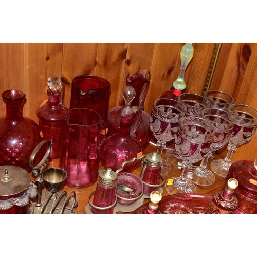 430 - A COLLECTION OF CRANBERRY GLASS AND OTHER GLASSWARES, to include cranberry glass vases, jugs, drinki... 