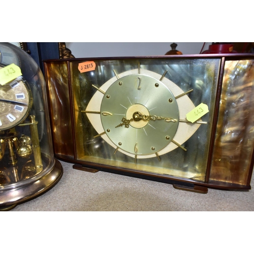 443 - A GROUP OF EIGHT MANTEL CLOCKS,  comprising a  Kieninger & Obergfell glass domed clock made in West ... 