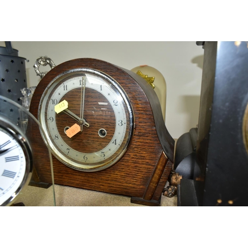 443 - A GROUP OF EIGHT MANTEL CLOCKS,  comprising a  Kieninger & Obergfell glass domed clock made in West ... 