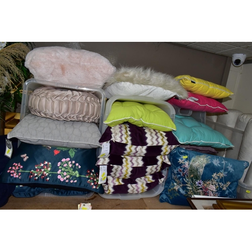 495 - A GROUP OF NEW AND UNUSED CUSHIONS, BOLSTERS, ARTIFICIAL PLANTS AND A LARGE BALE OF NAVY BLUE FABRIC... 