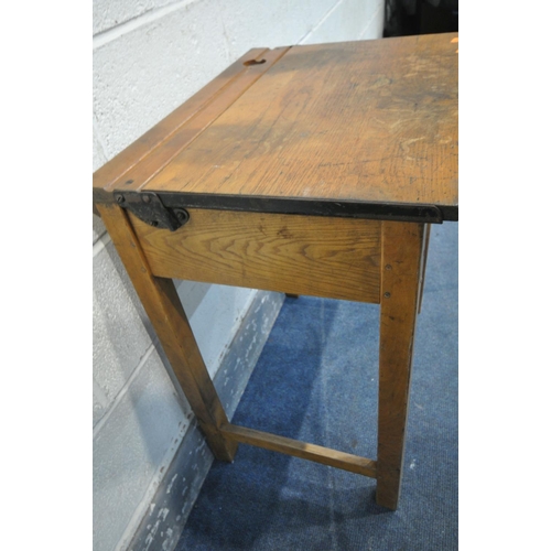 1335 - A PAIR OF 20TH CENTURY OAK SINGLE SCHOOL DESKS, with an metal banded open top lid, ink well section,... 