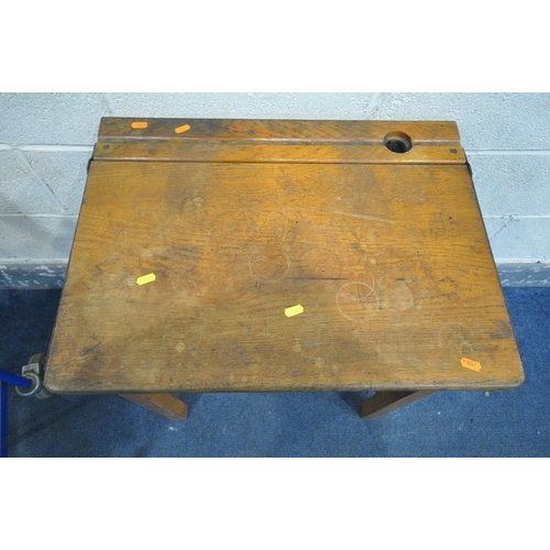 1335 - A PAIR OF 20TH CENTURY OAK SINGLE SCHOOL DESKS, with an metal banded open top lid, ink well section,... 