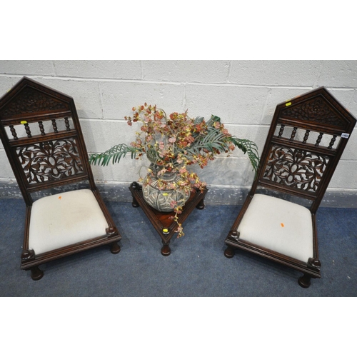 1493 - A PAIR OF HARDWOOD ORIENTAL CHAIRS, of very low proportions, with carved foliate detailing to back, ... 