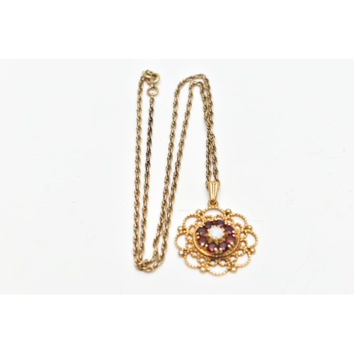 71 - A 9CT GOLD GEM SET PENDANT AND CHAIN, the pendant of an openwork circular form, centring on an eight... 