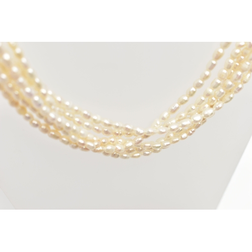 72 - A CULTURED FRESHWATER PEARL NECKLACE, multi strand pearl necklace, six strands of oval pearls, each ... 