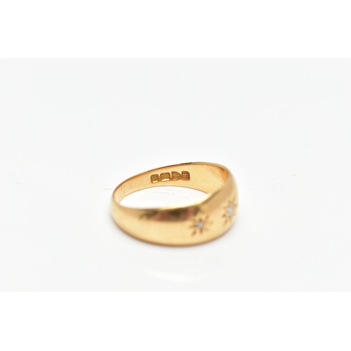 83 - AN 18CT GOLD THREE STONE DIAMOND GYPSY RING, a yellow gold tapered band ring, set with three old cut... 