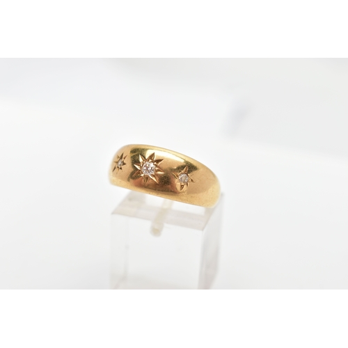 83 - AN 18CT GOLD THREE STONE DIAMOND GYPSY RING, a yellow gold tapered band ring, set with three old cut... 