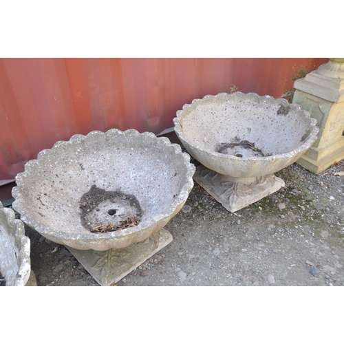 1006 - A PAIR OF COMPOSITE OYSTER SHELL GARDEN PLANTERS with shaped square bases, top is circular width and... 