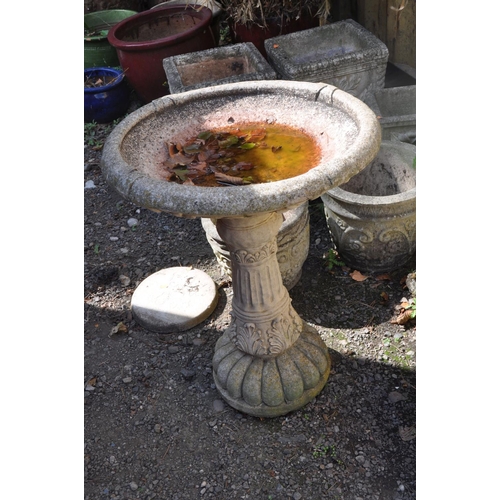 1013 - A MODERN COMPOSITE BIRD BATH on fluted and foliate detailed column base and a foliated detailed bowl... 