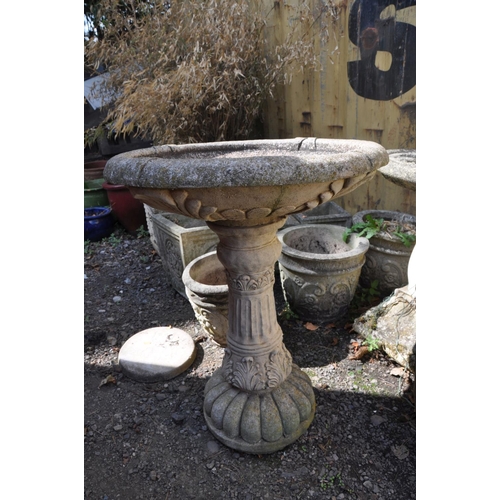 1013 - A MODERN COMPOSITE BIRD BATH on fluted and foliate detailed column base and a foliated detailed bowl... 