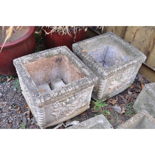 1017 - A PAIR OF MODERN COMPOSITE SQUARE GARDEN PLANTERS with foliate detail to each facet, rope edges and ... 