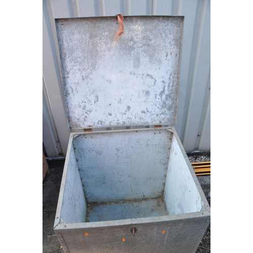 1020 - A GALVANISED STEEL ANIMAL FEED CONTAINER with a sloped hinged lid, width 75cm depth 70cm height at t... 