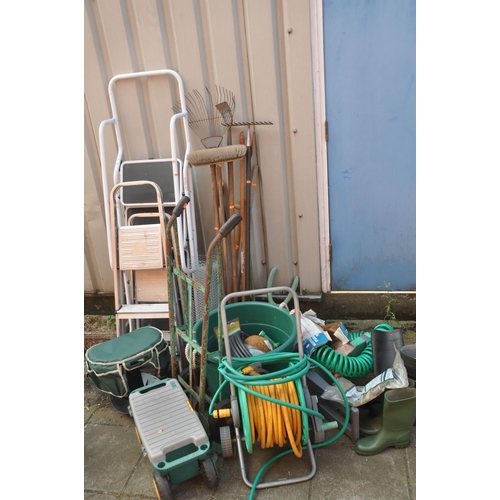 1022 - TWO SETS OF ALUMINIUM STEPS, a steel set of ladders, a hose reel, sack truck, step toolbox, and a qu... 