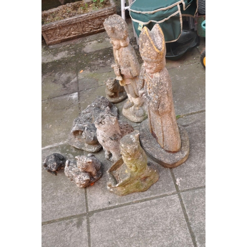 1023 - A SELECTION OF EIGHT COMPOSITE GARDEN FIGURES including a Bishop height 65cm, a town crier height 51... 