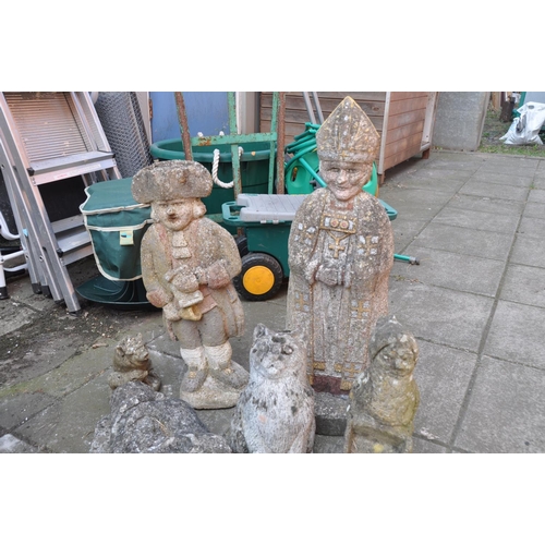 1023 - A SELECTION OF EIGHT COMPOSITE GARDEN FIGURES including a Bishop height 65cm, a town crier height 51... 