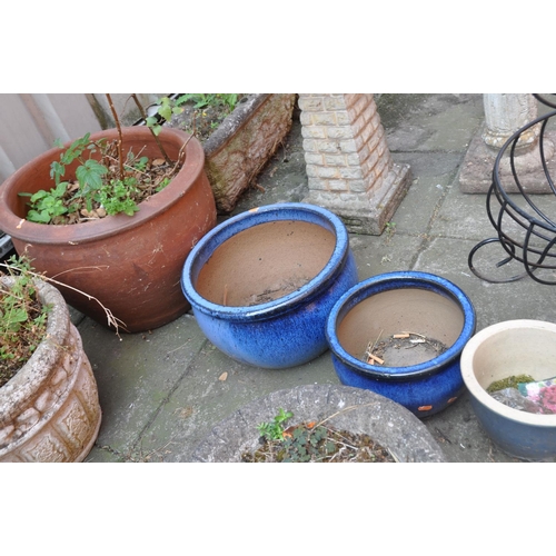 1026 - A VINTAGE TERRACOTTA CHIMNEY POT height 63cm, a large terracotta colour glazed planter diameter 52cm... 