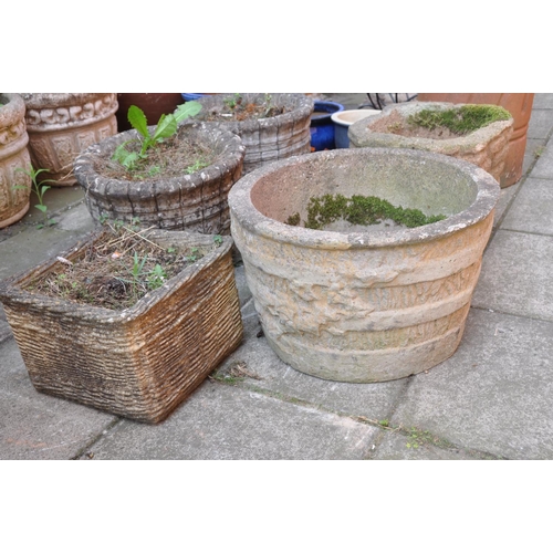 1028 - A PAIR OF COMPOSITE GARDEN PLANTERS with barrel effect detailing diameter 38cm height 39cm, and thre... 