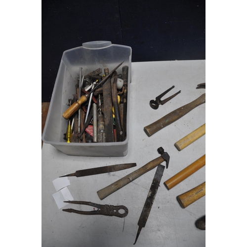 1084 - A TUB OF VINTAGE TOOLS to include hammers, files, spanners, two small oil cans, screwdrivers etc