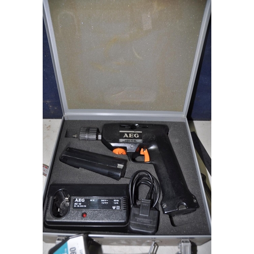 1086 - A AEG ABS10RL CORDLESS DRILL with charger and two spare batteries (UNTESTED) along with a tray of to... 