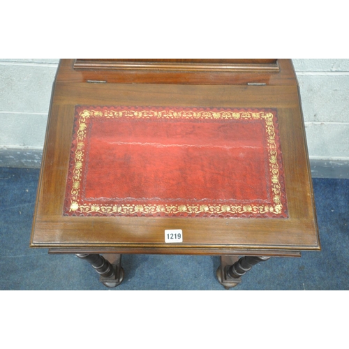 1219 - A 20TH CENTURY MAHOGANY DAVENPORT, with a raised back, red leather and gilt writing surface, on turn... 