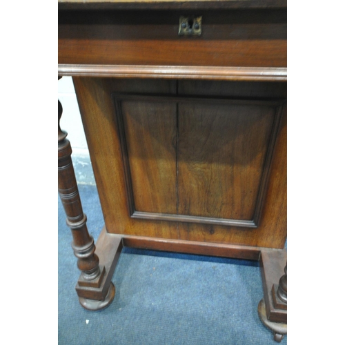 1219 - A 20TH CENTURY MAHOGANY DAVENPORT, with a raised back, red leather and gilt writing surface, on turn... 