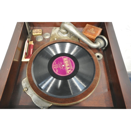 1233 - A 20TH CENTURY MAHOGANY GRAMOPHONE CABINET, with hinged lid, enclosing the turn table, above two cup... 