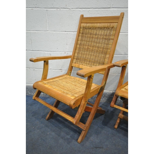 1241 - TWO FOLDING TEAK FOLDING ARMCHAIRS, with a rattan seat and back