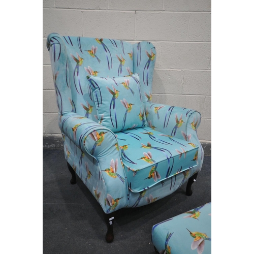 1266 - A REUPHOLSTERED HUMMINGBIRD WING BACK ARMCHAIR, on an aqua blue ground, width 83cm x depth 97cm x he... 