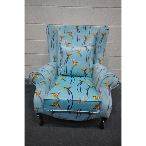 1266 - A REUPHOLSTERED HUMMINGBIRD WING BACK ARMCHAIR, on an aqua blue ground, width 83cm x depth 97cm x he... 