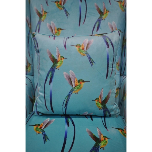 1266 - A REUPHOLSTERED HUMMINGBIRD WING BACK ARMCHAIR, on an aqua blue ground, width 83cm x depth 97cm x he... 