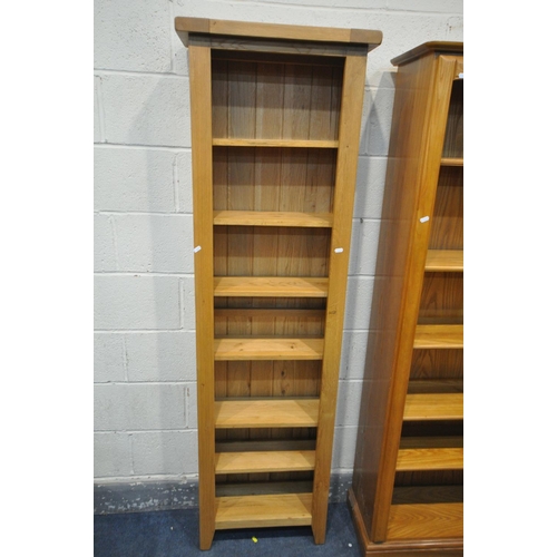 1300 - A SLIM LIGHT OAK OPEN BOOKCASE, with adjustable shelves, width 56cm x depth 24cm x height 186cm, and... 