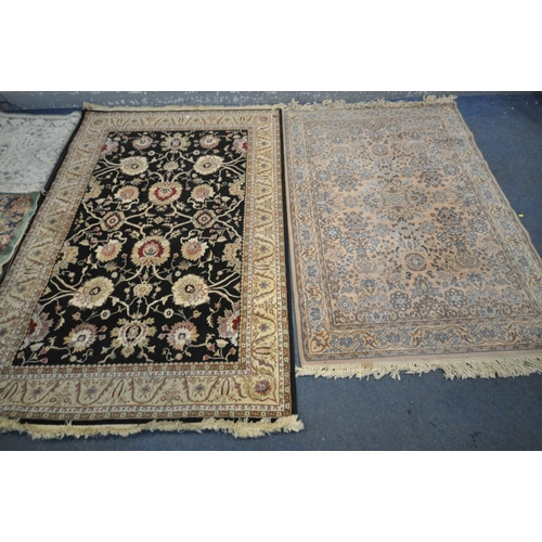 1309 - A SELECTION OF RUGS, to include a cream floral rug with a central black ground, 230cm x 160cm, a  sm... 