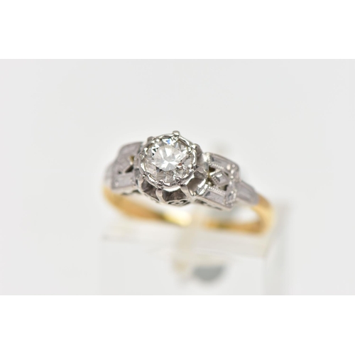 22 - A MID 20TH CENTURY DIAMOND SINGLE STONE RING, set with a round brilliant cut diamond, within an illu... 