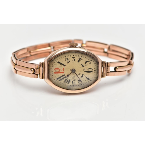 24 - AN EARLY 20TH CENTURY 9CT ROSE GOLD MANUAL WIND WRISTWATCH, the cream dial with black and red Arabic... 