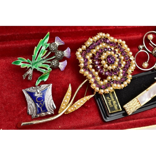 26 - A SELECTION OF COSTUME BROOCHES, to include a blue enamel brooch by Fattorini & Sons, a large purple... 