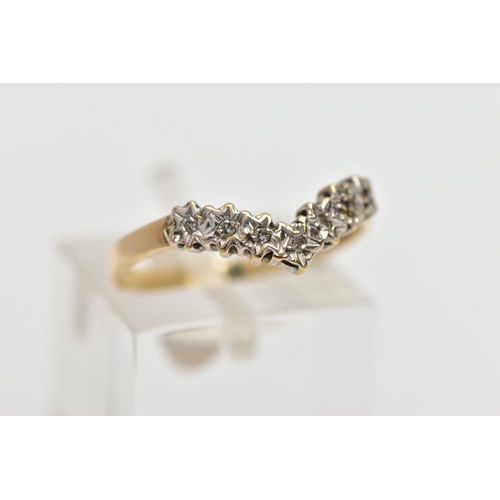 29 - A 9CT GOLD DIAMOND WISHBONE RING, designed as a series of illusion set diamonds, one diamond missing... 