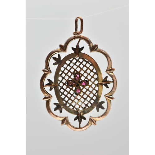 30 - A YELLOW METAL PENDANT, of openwork floral design, with pear cut garnet quatrefoil central panel, to... 