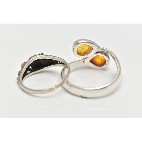 32 - TWO WHITE METAL RINGS, the first of asymmetric design set with two pear copal resin cabochons, stamp... 