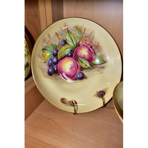 323 - TWO AYNSLEY ORCHARD GOLD PEDESTAL BOWLS, with printed fruit on a cream ground, the central image of ... 