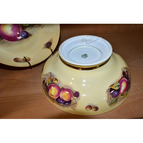 323 - TWO AYNSLEY ORCHARD GOLD PEDESTAL BOWLS, with printed fruit on a cream ground, the central image of ... 