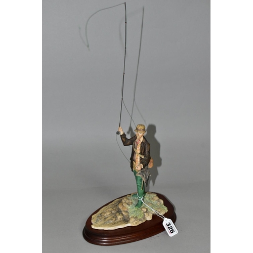 326 - A BORDER FINE ARTS FLY FISHERMAN, model number 110, sculptor David Geenty, supported on a wooden pli... 