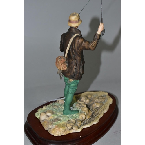 326 - A BORDER FINE ARTS FLY FISHERMAN, model number 110, sculptor David Geenty, supported on a wooden pli... 