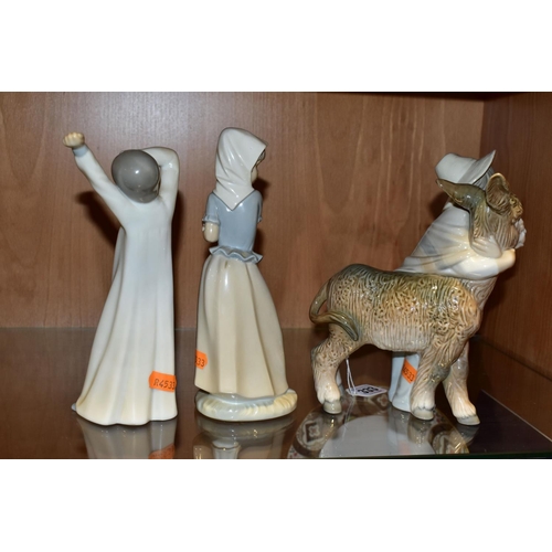 333 - THREE LLADRO AND NAO FIGURES, comprising a Lladro 'Platero and Marcelino' figure depicting a boy wit... 