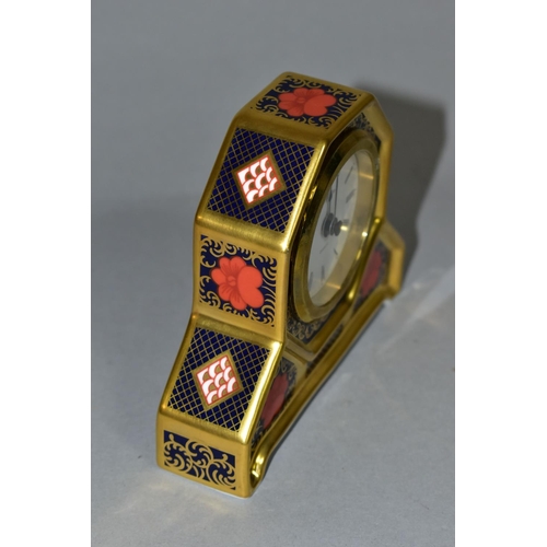 349 - A ROYAL CROWN DERBY OLD IMARI 1128 SOLID GOLD DESK CLOCK, the quartz movement contained in an octago... 