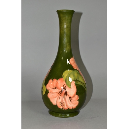 369 - A LARGE MOORCROFT POTTERY BOTTLE VASE, in the coral 'Hibiscus' pattern on a green ground, height 32c... 