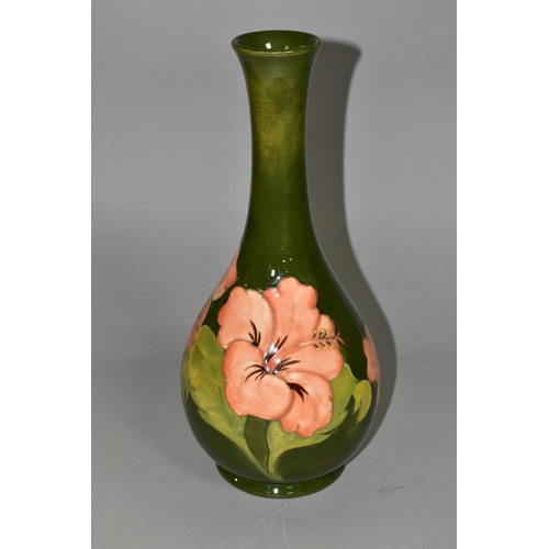 369 - A LARGE MOORCROFT POTTERY BOTTLE VASE, in the coral 'Hibiscus' pattern on a green ground, height 32c... 