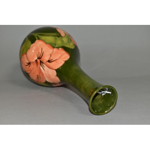 369 - A LARGE MOORCROFT POTTERY BOTTLE VASE, in the coral 'Hibiscus' pattern on a green ground, height 32c... 